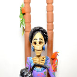 Catrina Frida on chair